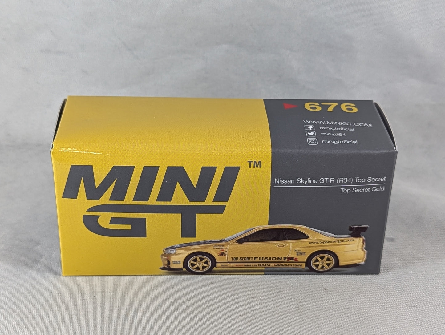 Mini GT Nissan Skyline GT-R (R34) Top Secret Gold