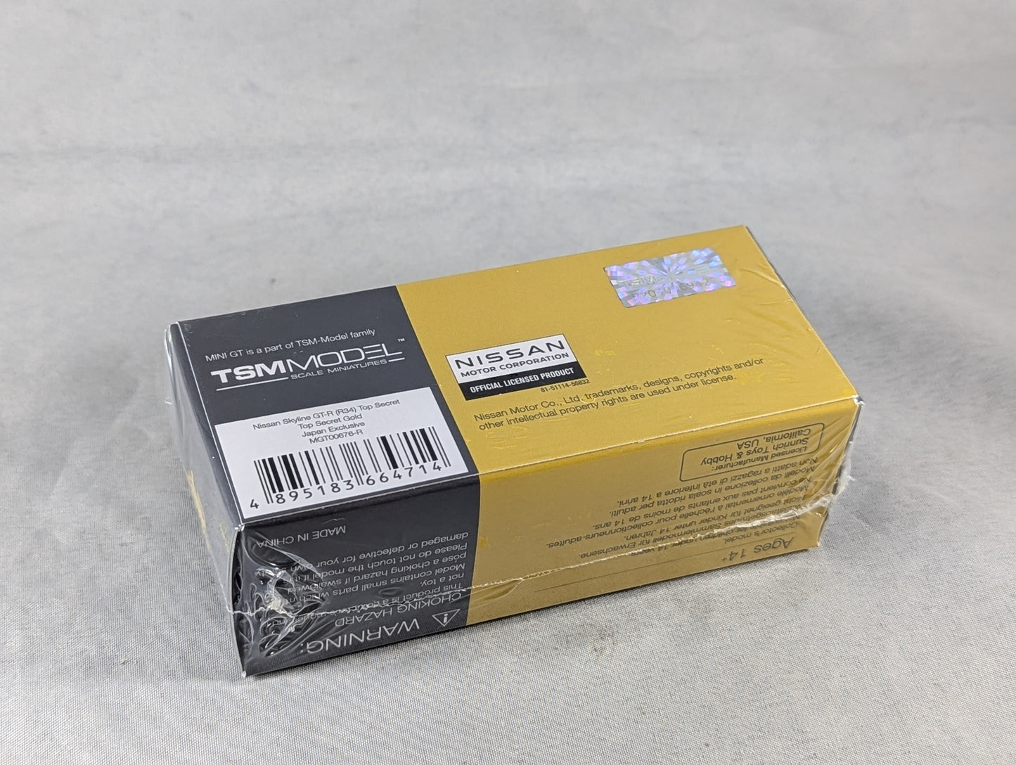 Mini GT Nissan Skyline GT-R (R34) Top Secret Gold