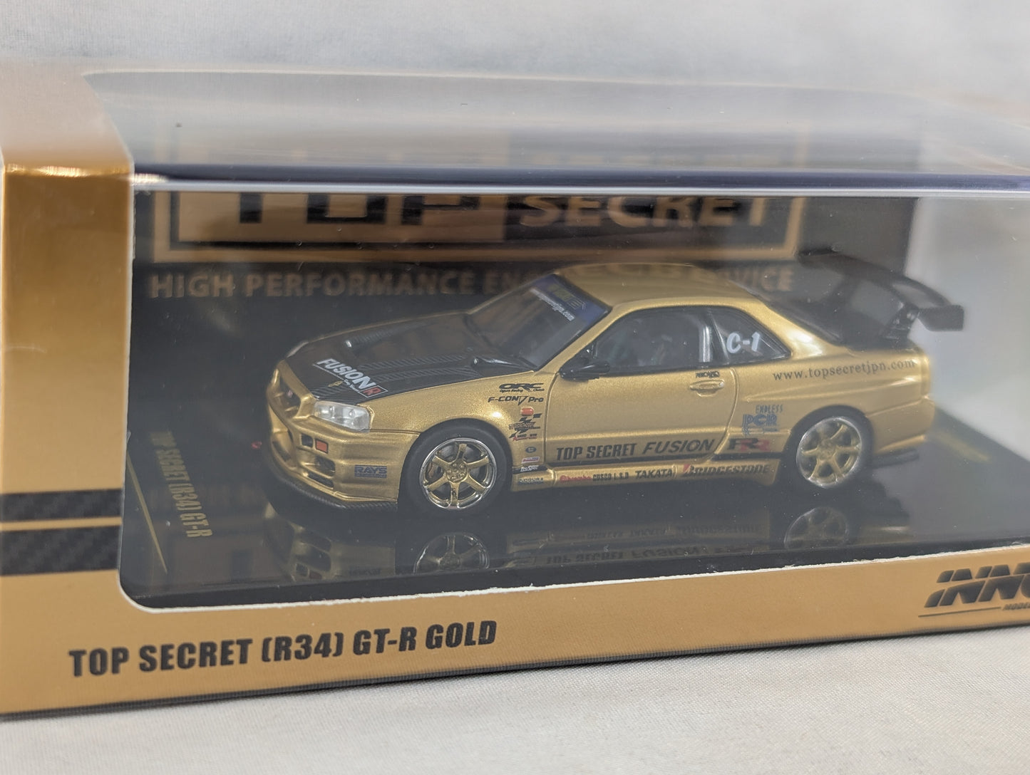 INNO64 Nissan Skyline GTR R34 Top Secret Gold