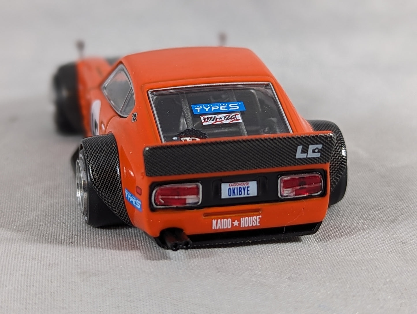 Kaido House Mini GT Nissan Fairlady Z 'Orange bang' Larry Chen V1 #100 Sealed